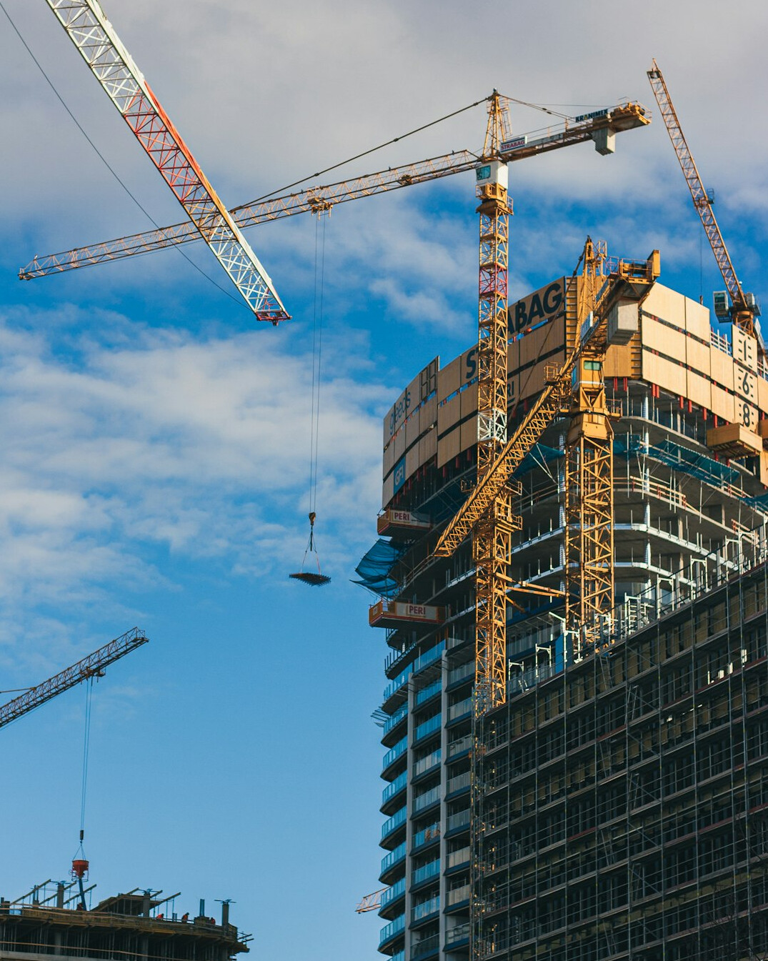 Construction site with cranes and scaffolding