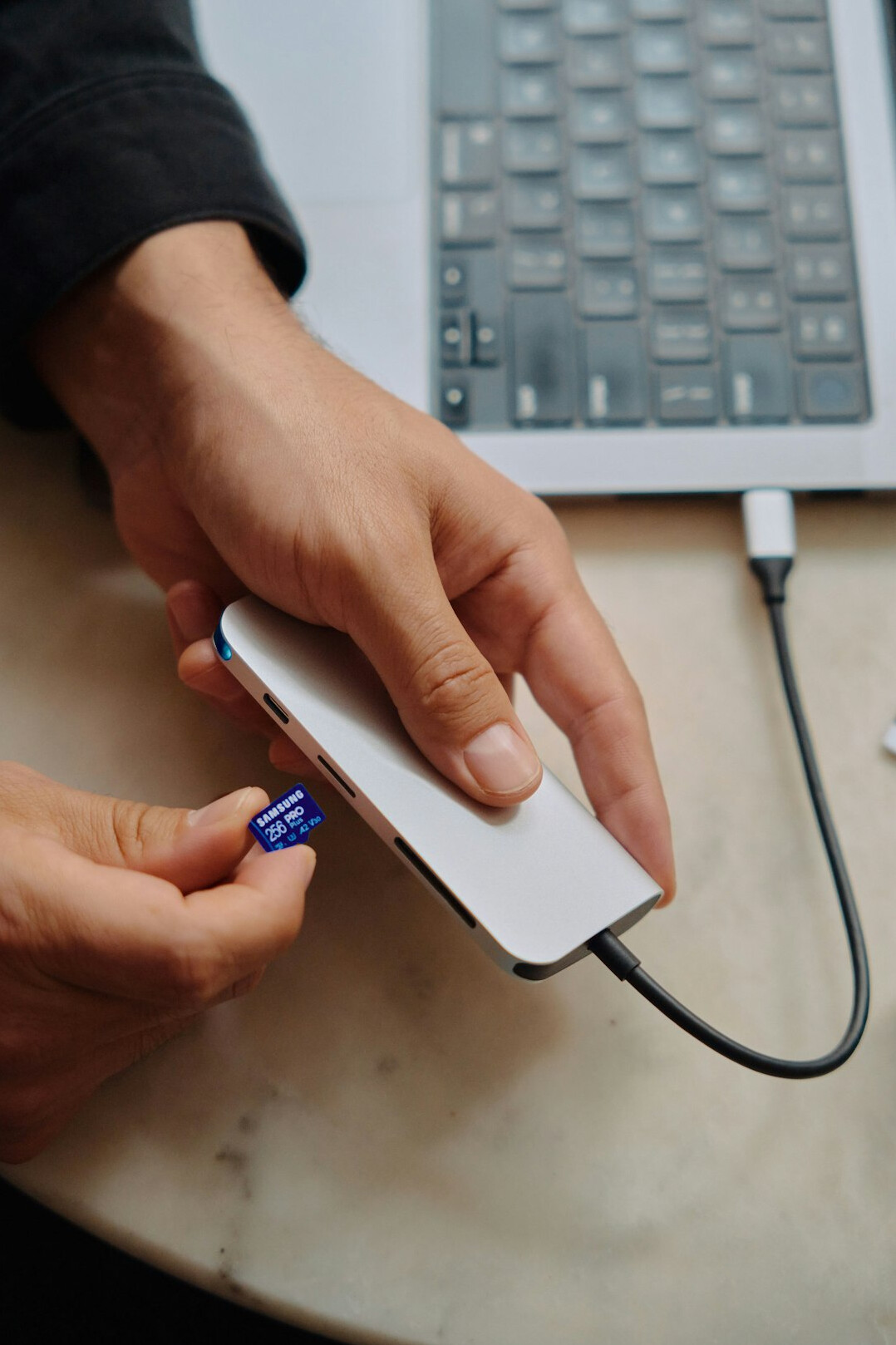 Person typing a secure encrypted message on a laptop