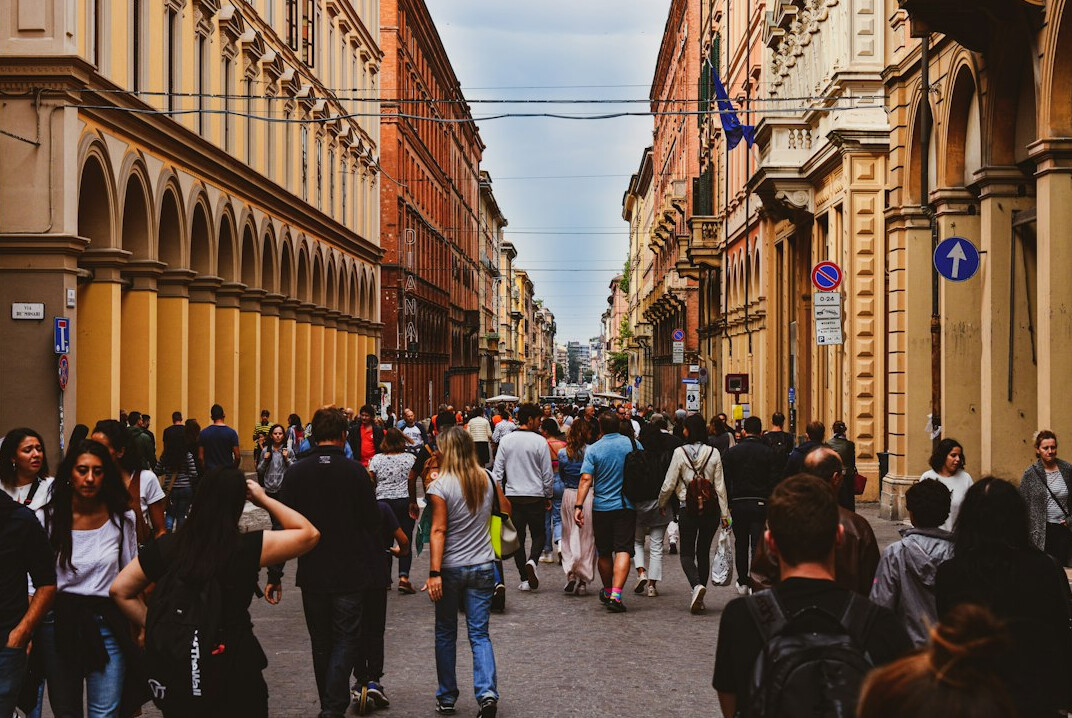 Crowded historic street filled with tourists